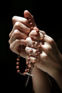 4331084-praying-in-the-dark-with-a-rosary